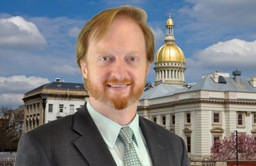 John-Bartlett-in-front-of-statehouse John-Bartlett-in-front-of-statehouse